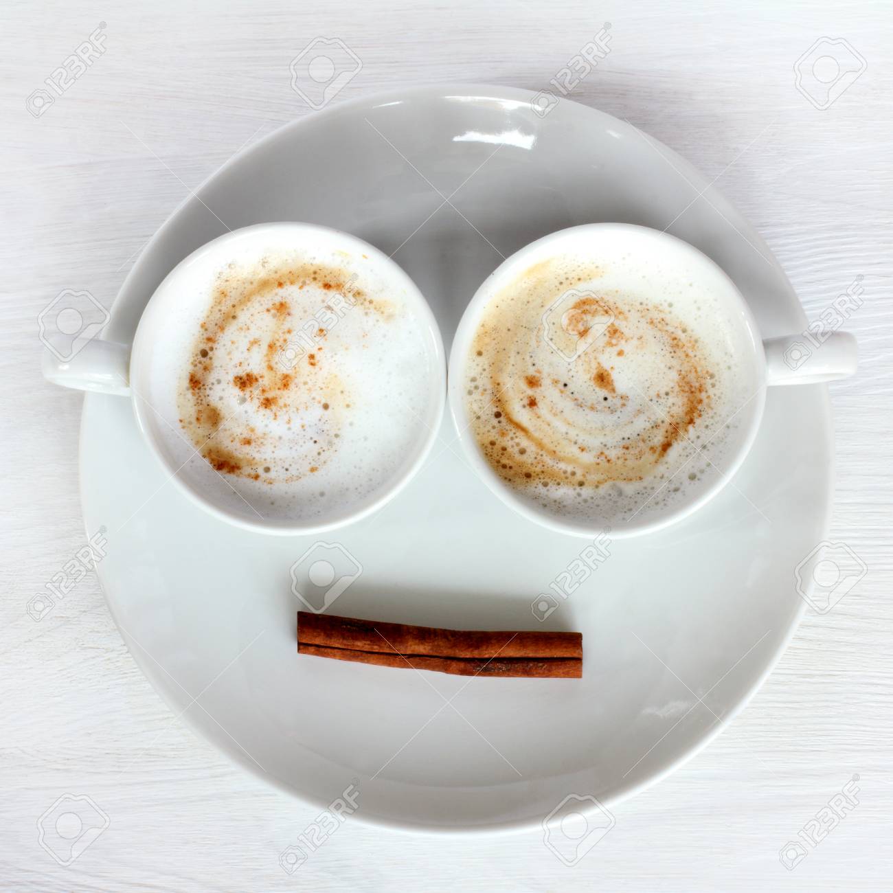 two white cups with