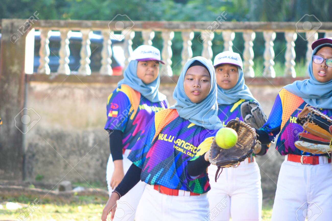 KUALA LUMPUR MALAYSIA,FEBRUARY 25th 2020: Kids plays amateur softball in park. - 142789869 KUALA LUMPUR MALAYSIA,FEBRUARY 25th 2020: Kids plays amateur softball in park. - 142789869
