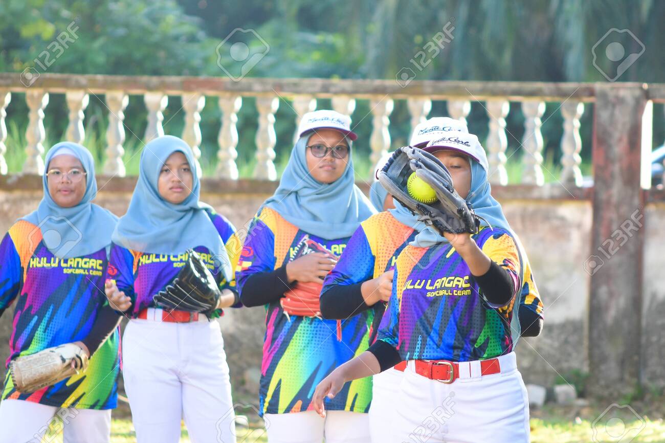 KUALA LUMPUR MALAYSIA,FEBRUARY 25th 2020: Kids plays amateur softball in park. - 142789870 KUALA LUMPUR MALAYSIA,FEBRUARY 25th 2020: Kids plays amateur softball in park. - 142789870