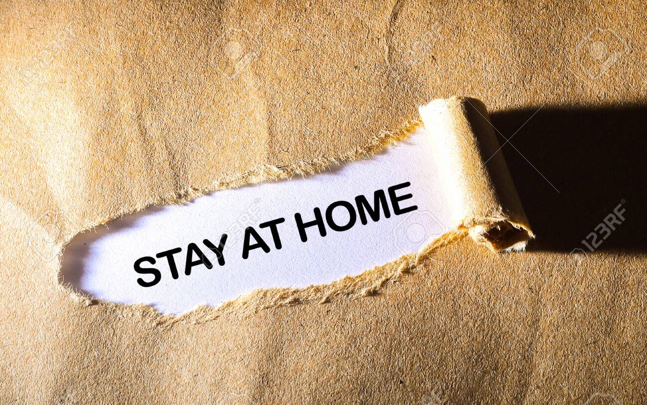 Torn paper with word STAY AT HOME - 143214734 Torn paper with word STAY AT HOME - 143214734