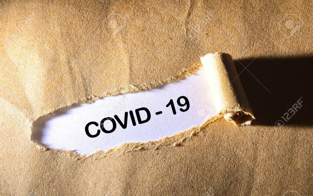 torn paper with word Covid 19 - 143214744 torn paper with word Covid 19 - 143214744