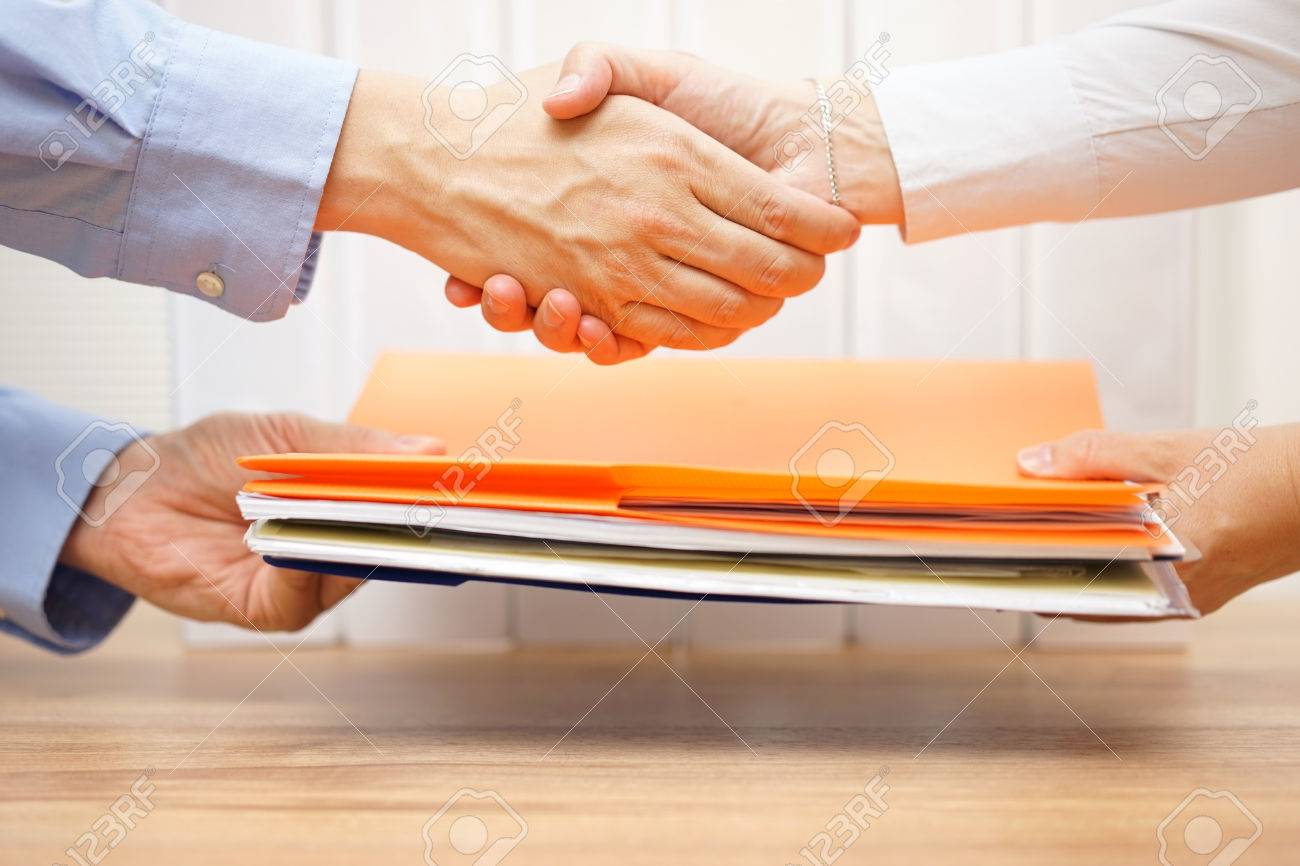 entrepreneur shaking hands with his accuntant after passing documenation and invoices - 44683822 entrepreneur shaking hands with his accuntant after passing documenation and invoices - 44683822