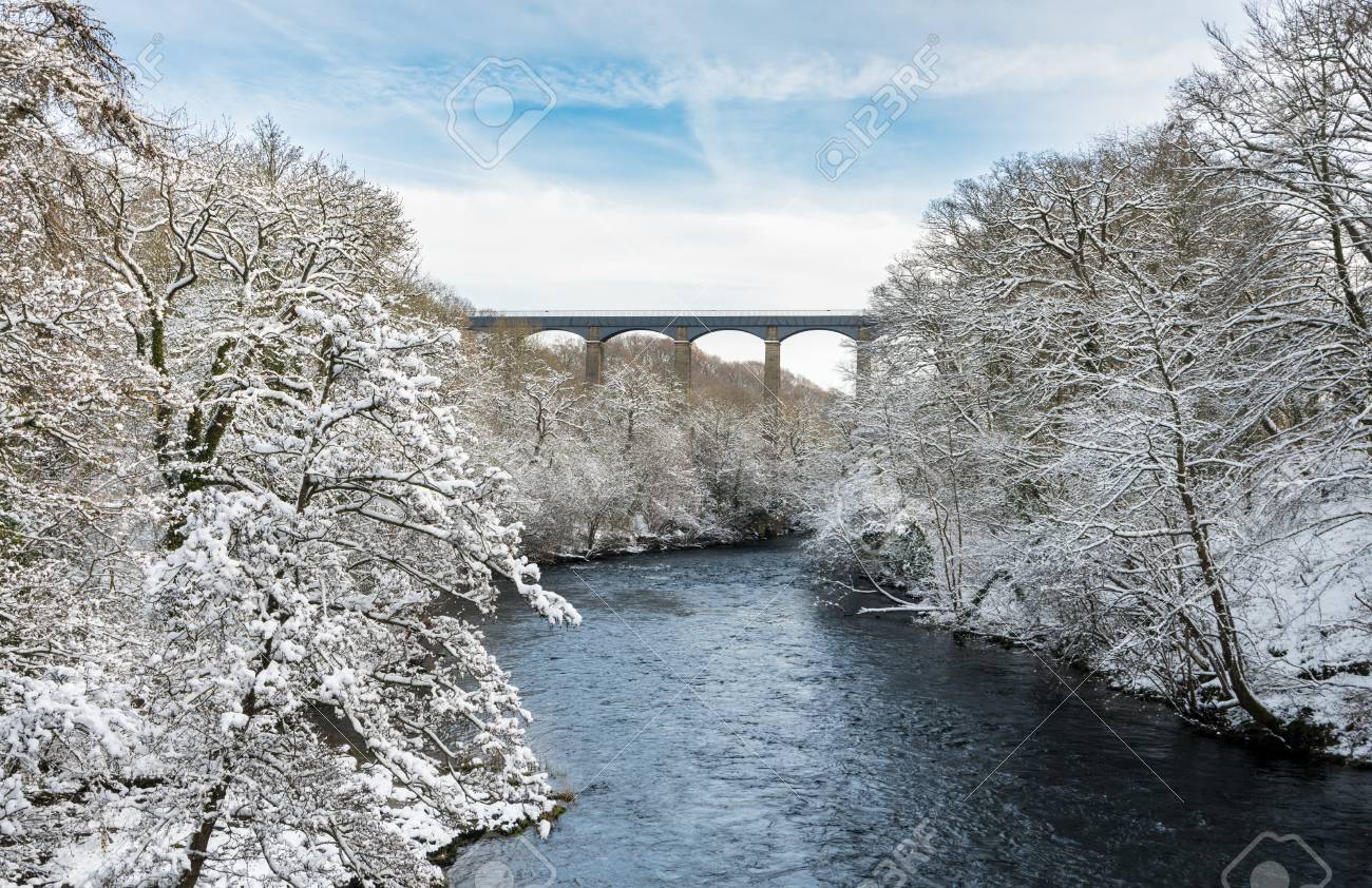Viaduct carrying canal over the river near Llangollen in Wales during a winter snow storm