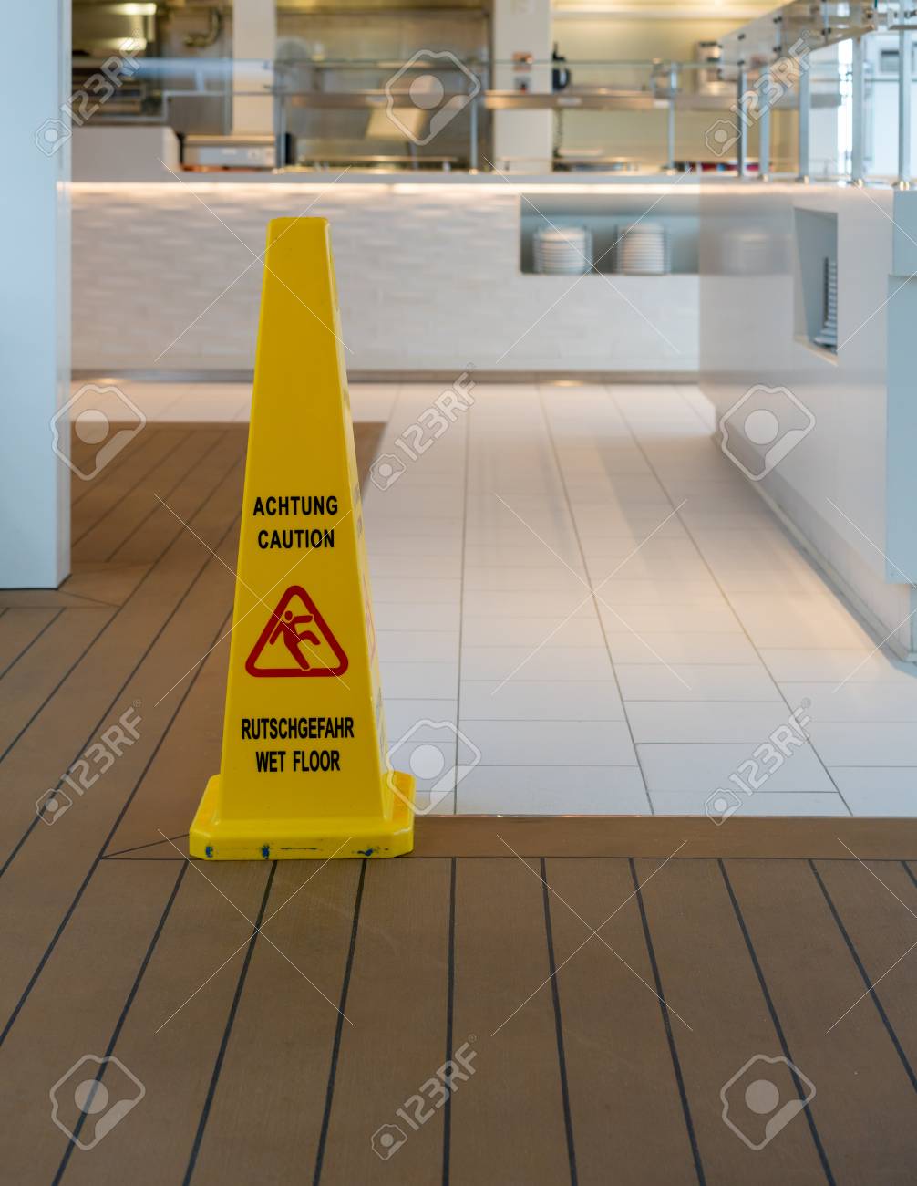 Wet Floor Warning Triangle In Modern Kitchen Or Restaurant In