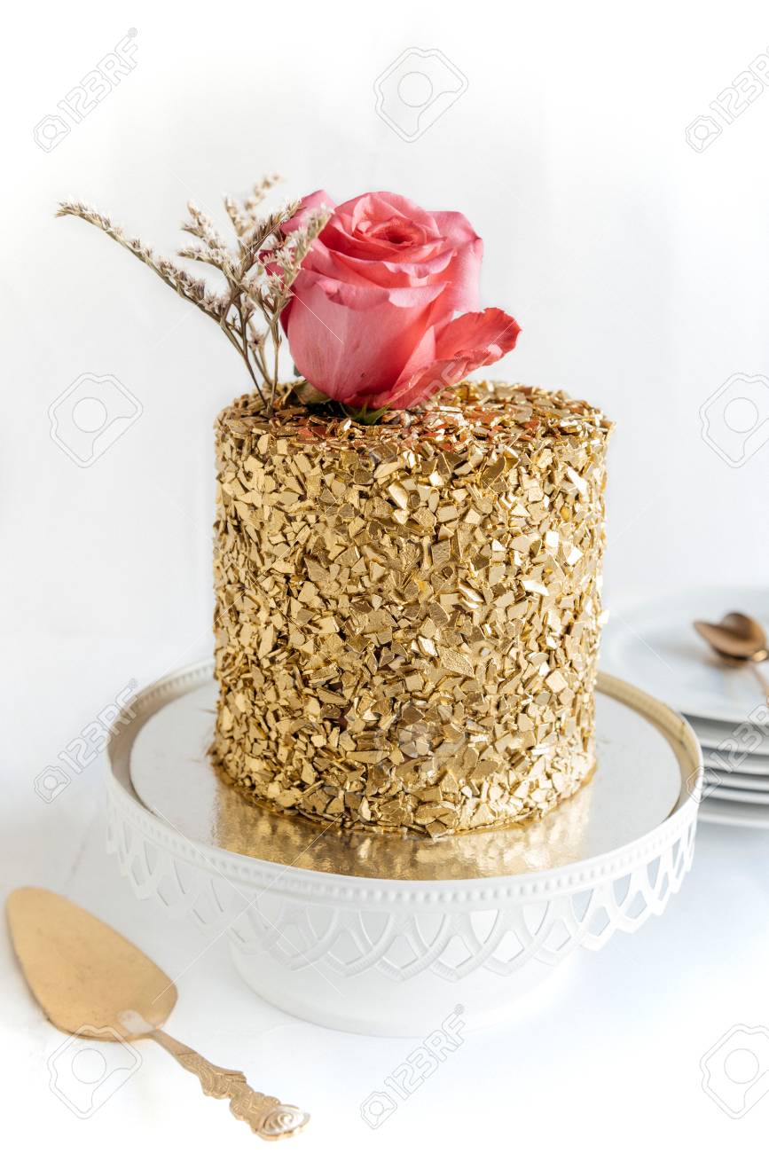 Seved Golden Cake With The Rose On Top Selective Focus Stock Photo Picture And Royalty Free Image Image