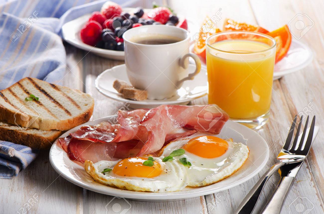 coffee cup two eggs and bacon for healthy breakfast stock photo