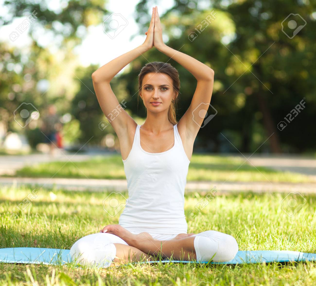 Lotus Pose With Hands Over Head Lotus Pose With Hands Over Head