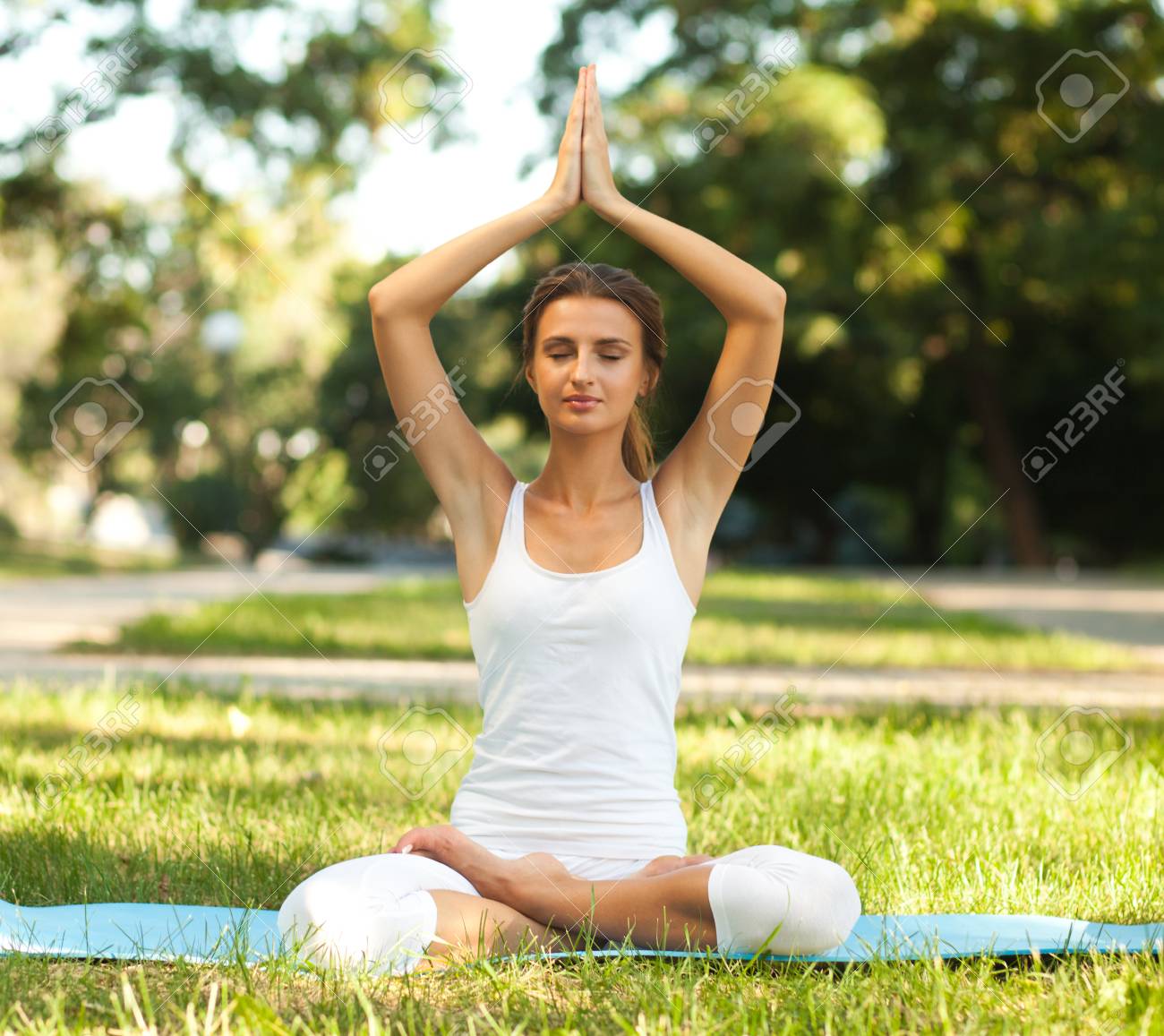 Lotus Pose With Hands Over Head Lotus Pose With Hands Over Head