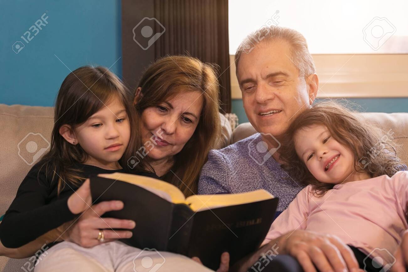 Grandparents teaching grandchildren about the Holy Bible - 146519278 Grandparents teaching grandchildren about the Holy Bible - 146519278