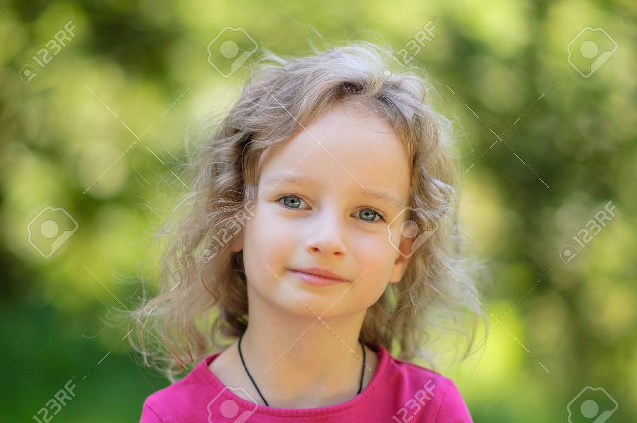 Beautiful Little Curly Blonde Girl Has Happy Fun Cheerful Smiling