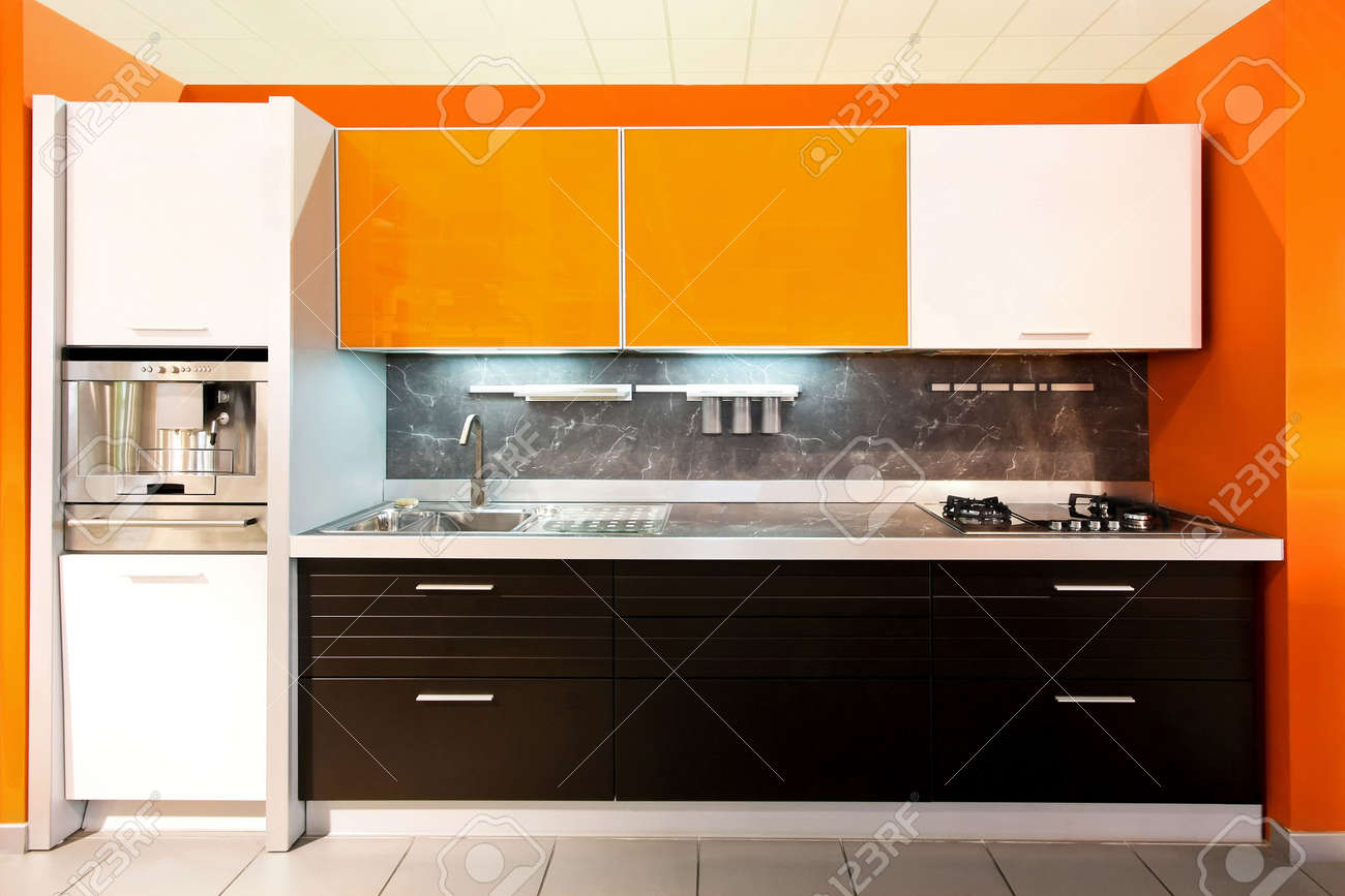 Contemporary Orange Kitchen With Silver Coffee Maker Stock Photo Contemporary Orange Kitchen With Silver Coffee Maker Stock Photo