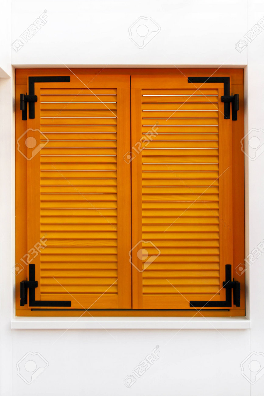 Retro wooden window shutters on white wall stock photo 11733678