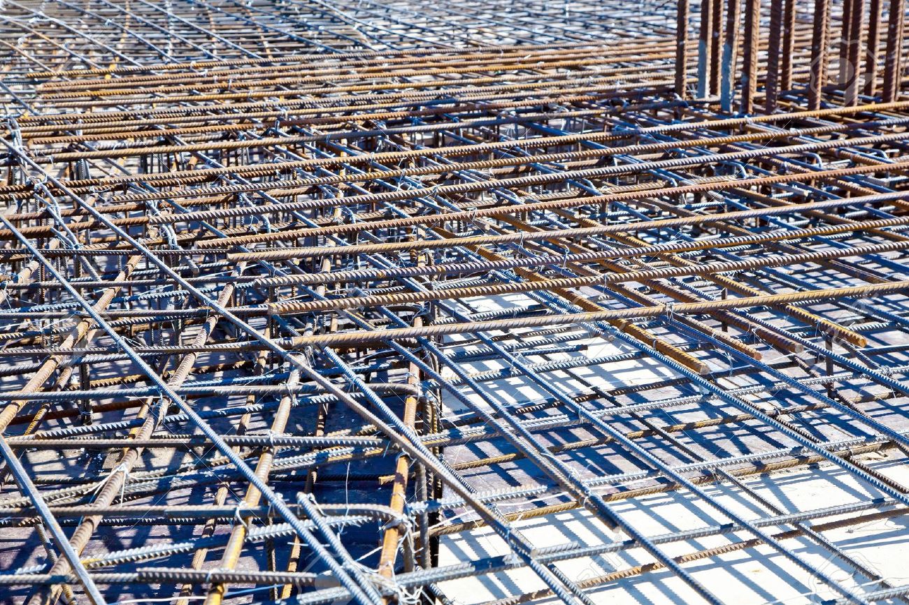 Steel bars for reinforcing concrete. Floor at construction site ready for a concrete pouring - 12192476 Steel bars for reinforcing concrete. Floor at construction site ready for a concrete pouring - 12192476