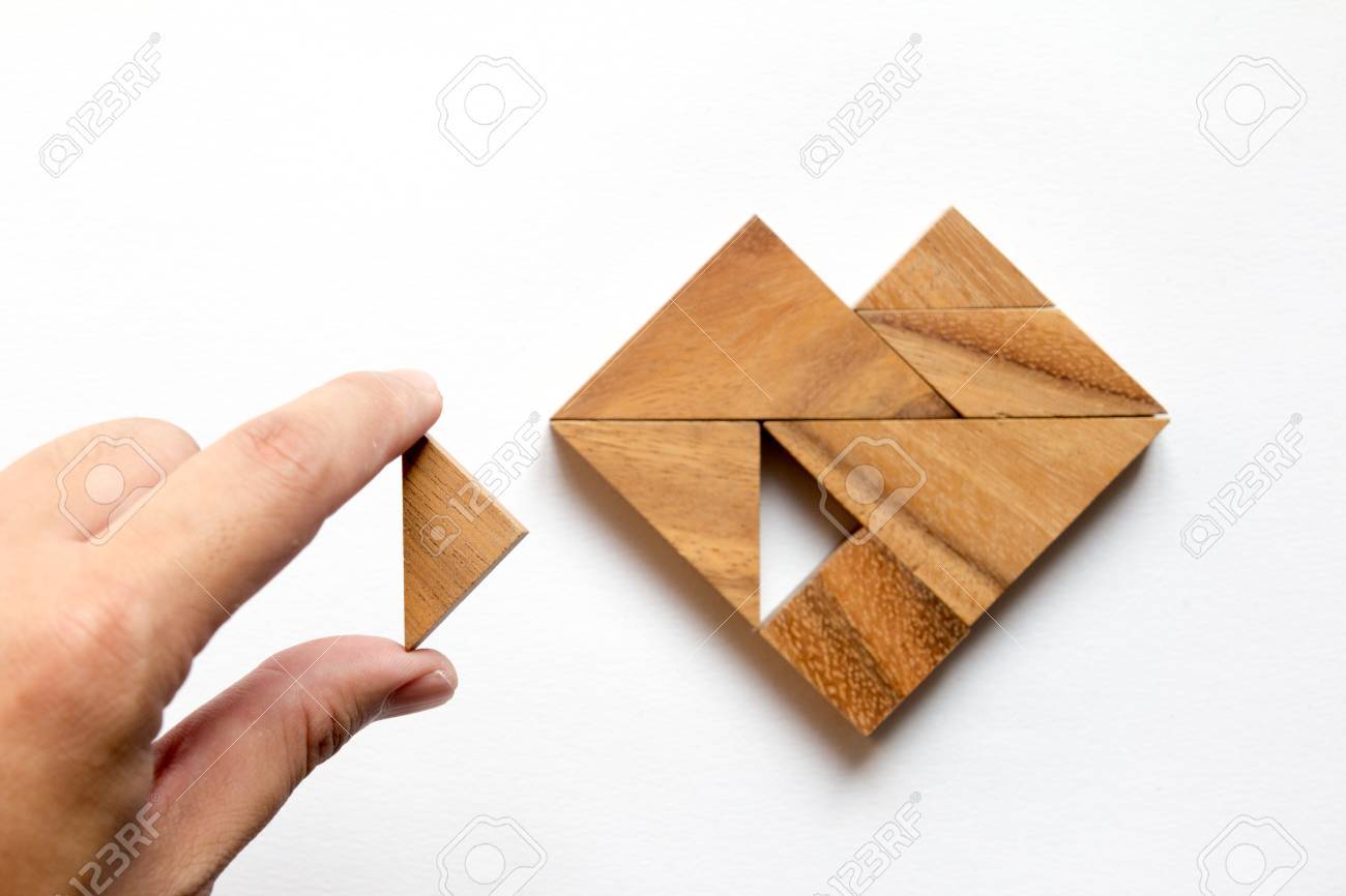 Man held piece of tangram puzzle to fulfill the heart shape on white background (Concept of love) - 71044683 Man held piece of tangram puzzle to fulfill the heart shape on white background (Concept of love) - 71044683