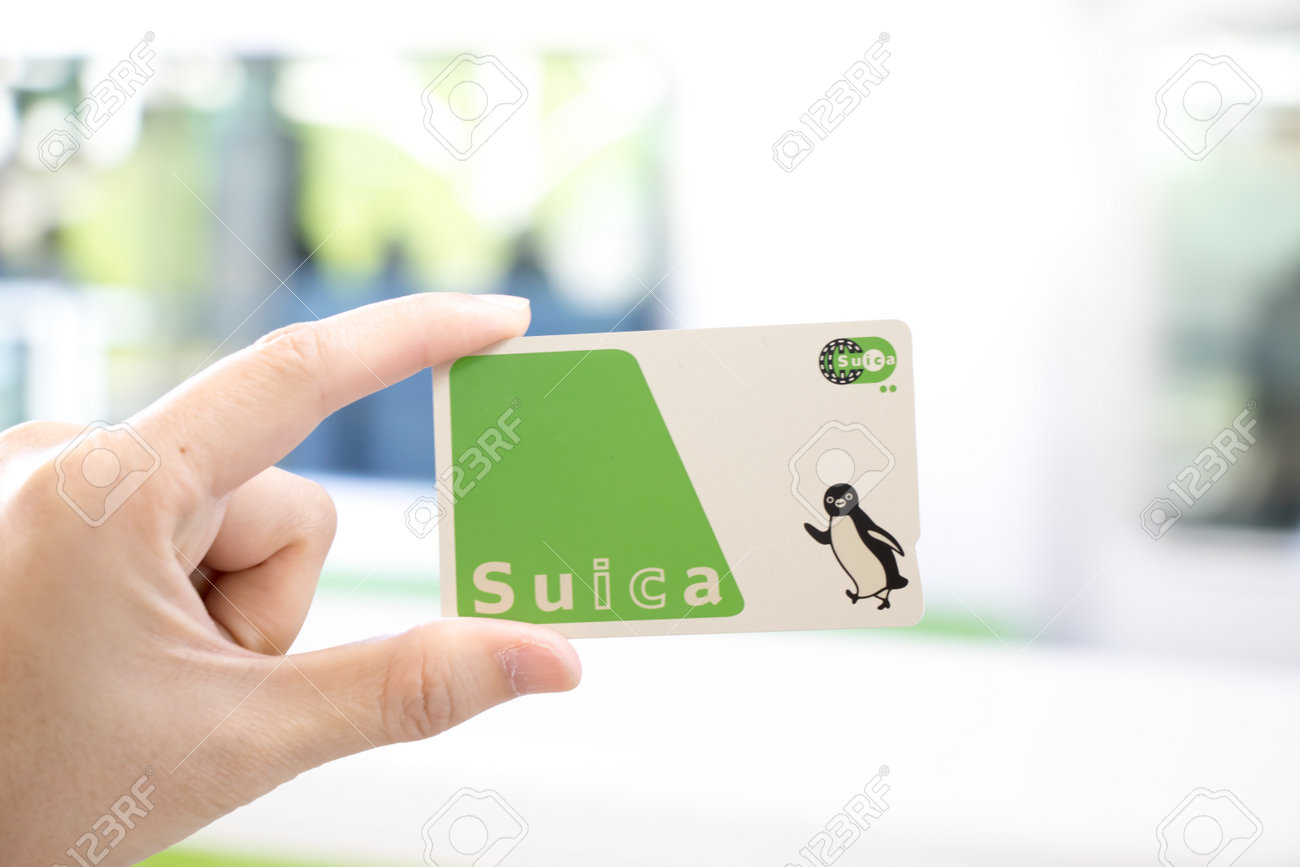 Tokyo, Japan - April 23, 2017 : Man hold Suica pass with the blurred background, Suica is a prepaid card for travelling with train, bus and shopping in Japan. - 79206593 Tokyo, Japan - April 23, 2017 : Man hold Suica pass with the blurred background, Suica is a prepaid card for travelling with train, bus and shopping in Japan. - 79206593