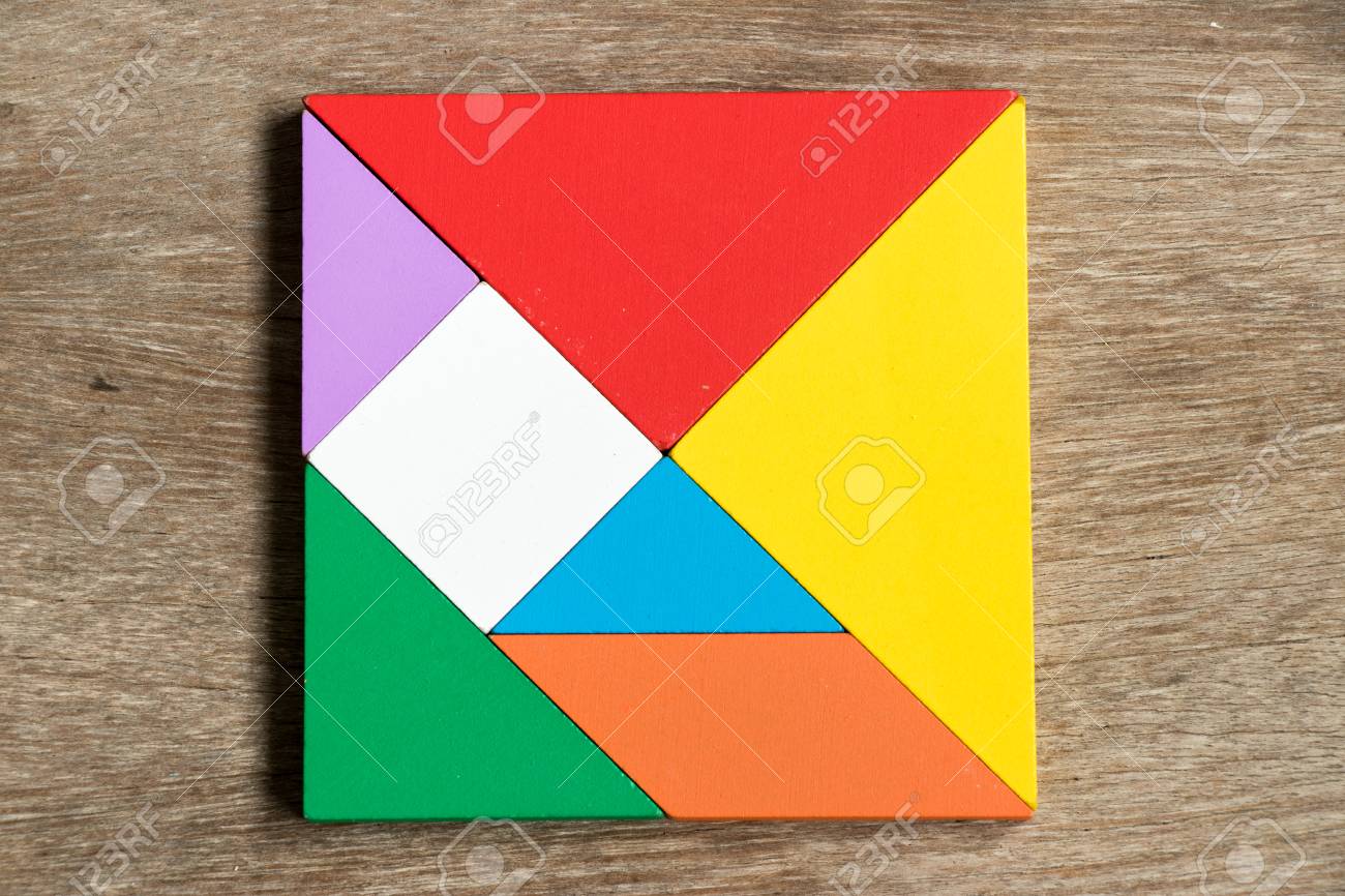 Colorful tangram puzzle in square shape on wood background - 86698916 Colorful tangram puzzle in square shape on wood background - 86698916