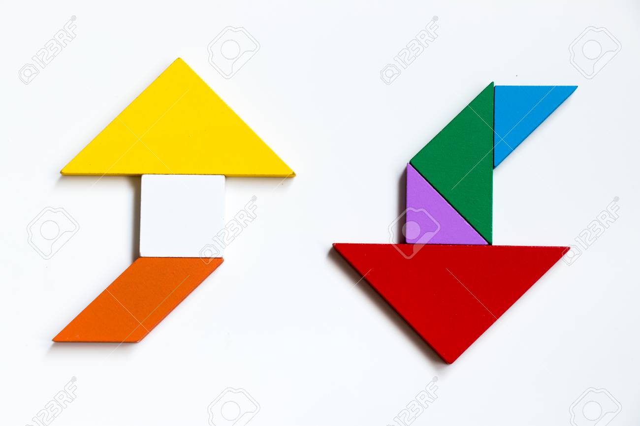 Rompecabezas De Tangram De Madera De Color En Forma De Flecha De Dirección En El Lado Opuesto Sobre Fondo Blanco Fotos, Retratos, Imágenes Y Fotografía De Archivo Libres De Derecho. Image 87551350.