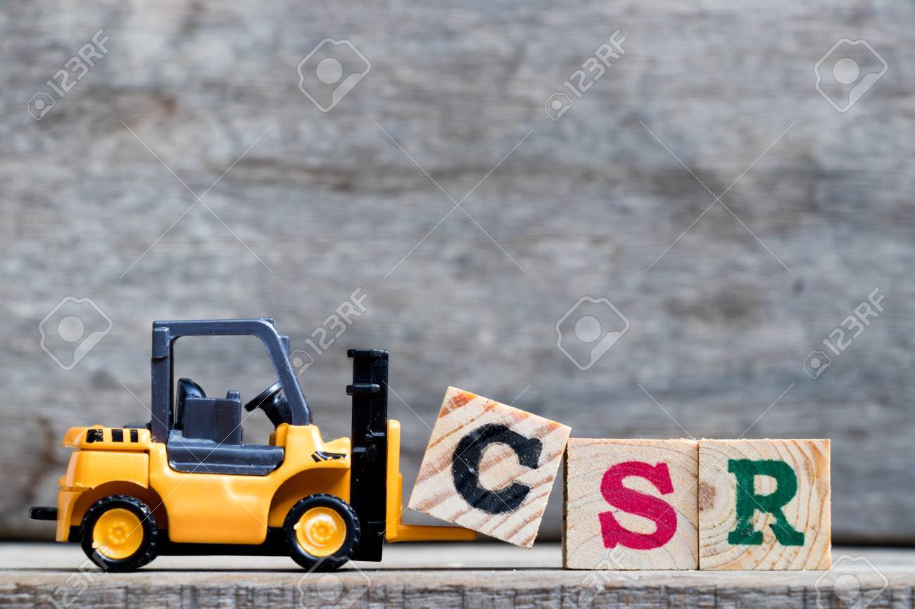 Yellow plastic forklift hold letter C to complete word CSR (Abbreviation from corporate social responsibility) on wood background - 89704806 Yellow plastic forklift hold letter C to complete word CSR (Abbreviation from corporate social responsibility) on wood background - 89704806