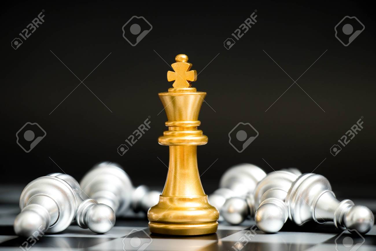 Gold king in chess game face with the another silver team on black background (Concept for company strategy, business victory or decision) - 89755235 Gold king in chess game face with the another silver team on black background (Concept for company strategy, business victory or decision) - 89755235