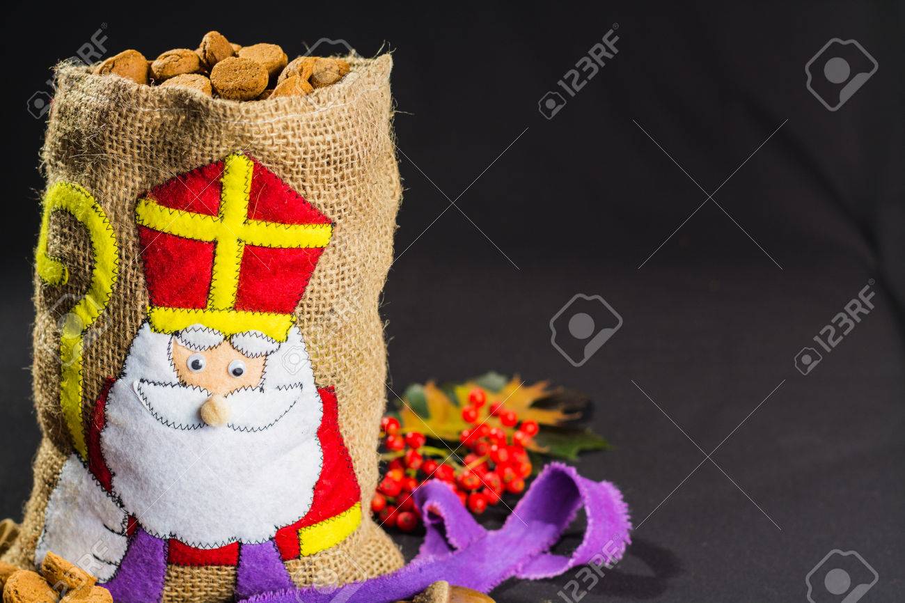 'De zak van Sinterklaas' (St. Nicholas' bag) filled with 'pepernoten'. Traditional Dutch holiday 'Sinterklaas'. - 65664854 'De zak van Sinterklaas' (St. Nicholas' bag) filled with 'pepernoten'. Traditional Dutch holiday 'Sinterklaas'. - 65664854