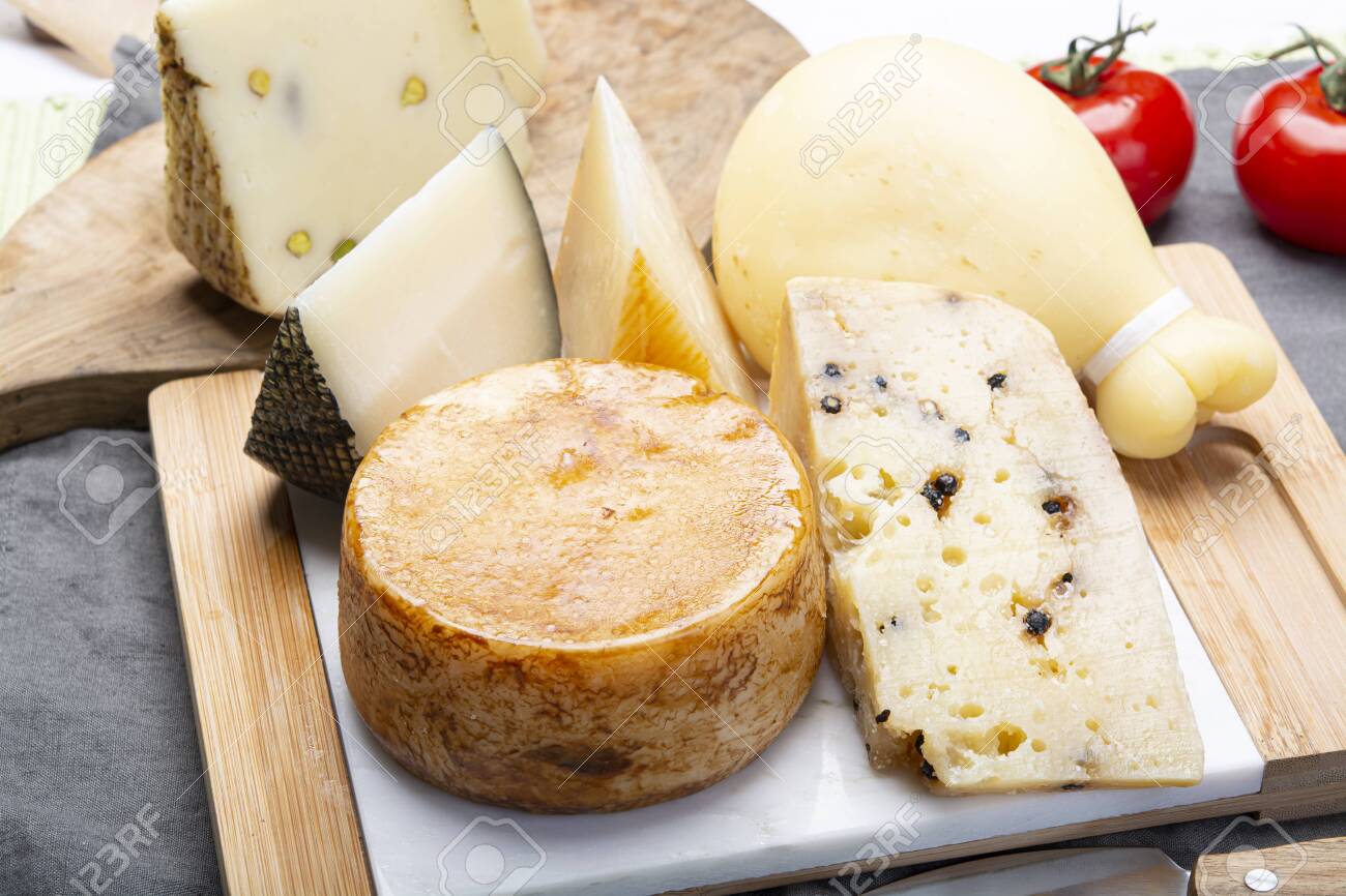 Cheese collection, Variety of Italian pecorino and provolone cheeses, aged with black peppers from Nebrodi, white Il Palio and black molarotto, close up - 125395361 Cheese collection, Variety of Italian pecorino and provolone cheeses, aged with black peppers from Nebrodi, white Il Palio and black molarotto, close up - 125395361