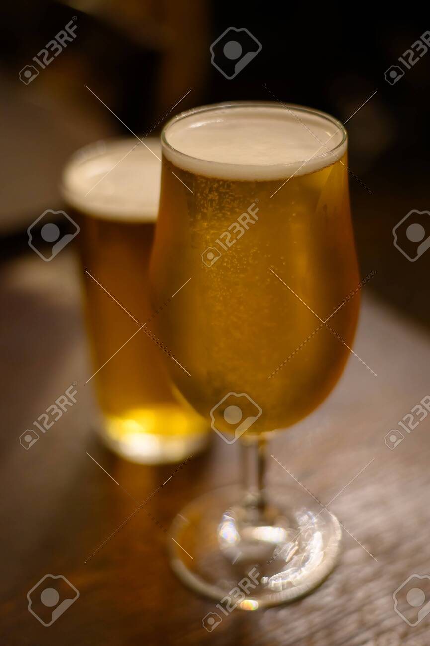 Misty glasses with two pints of cold Scotch ale, pale ale, lager draft beer in English pub close up - 139226334 Misty glasses with two pints of cold Scotch ale, pale ale, lager draft beer in English pub close up - 139226334