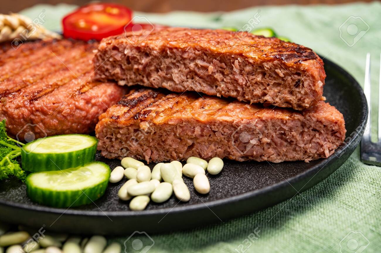 Source of fiber plant based vegan soya protein grilled burgers, meat free healthy food close up - 152000674 Source of fiber plant based vegan soya protein grilled burgers, meat free healthy food close up - 152000674