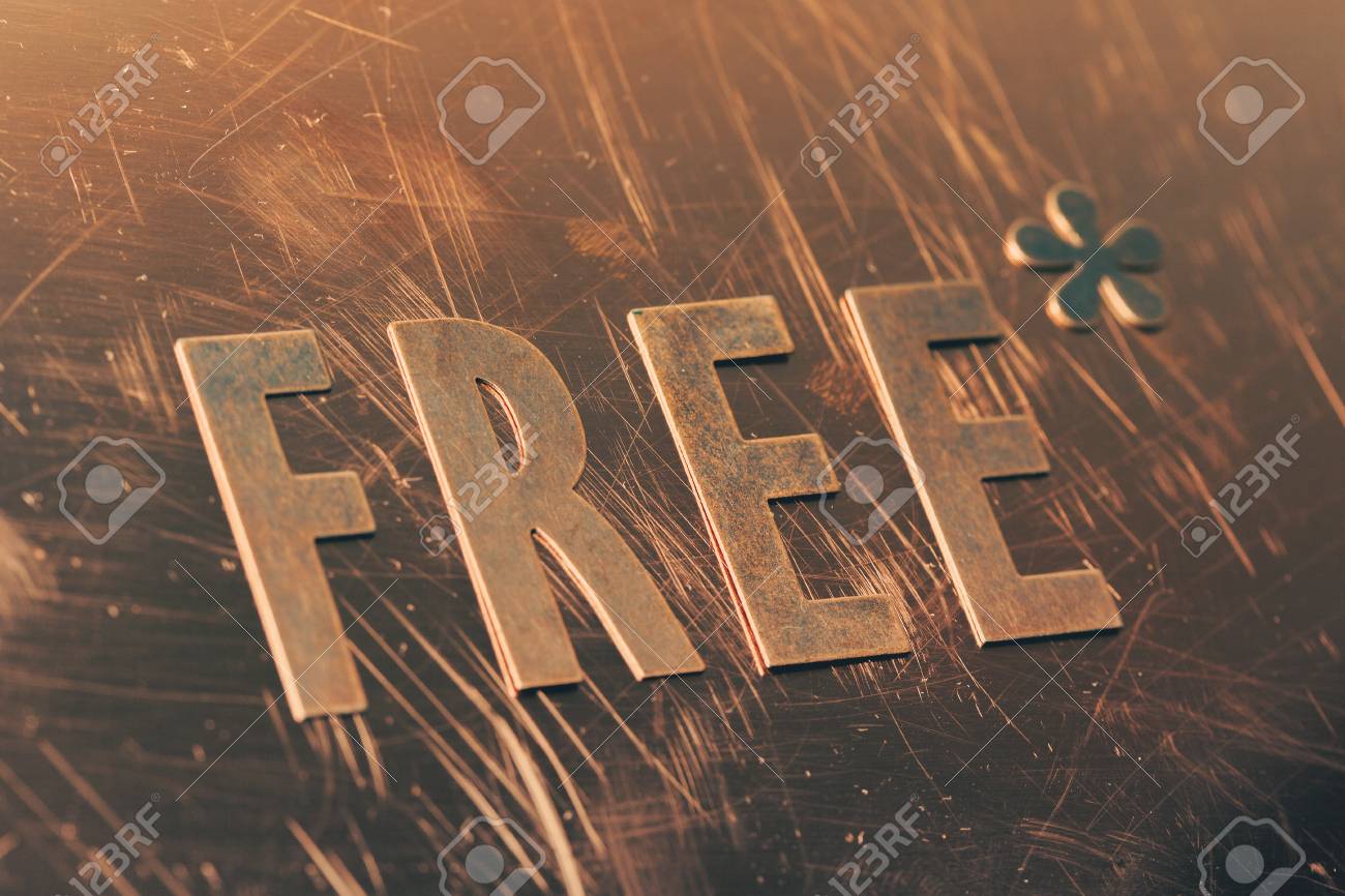 cut copper letters forming the word free with an asterisk stock