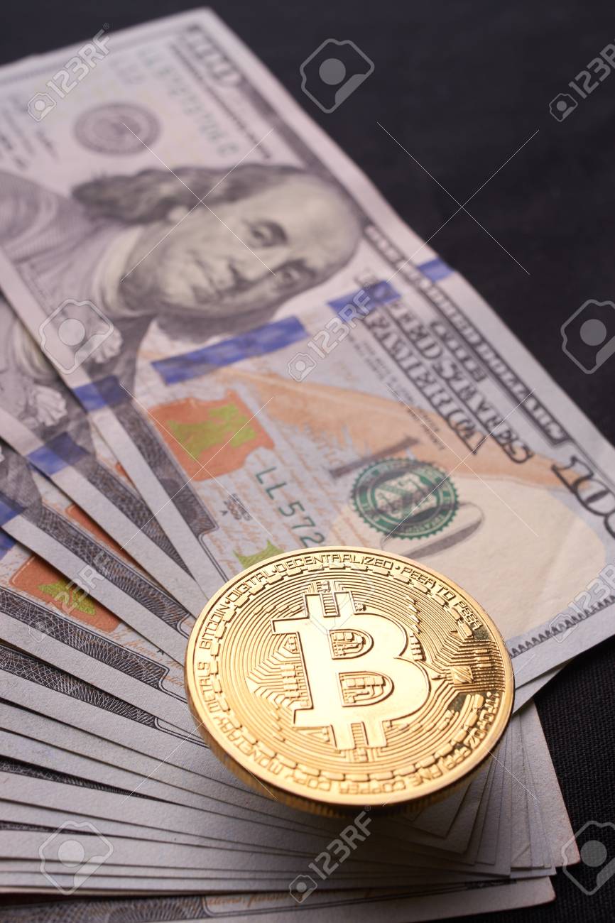 Golden Metal Bitcoin On Dollar Bills Background. A Lot Of Money In Cash. 100  Dollars Texture. Dear Bitcoin. Gold Coin. Profit From Mining Stock Photo,  Picture and Royalty Free Image. Image 105617202.