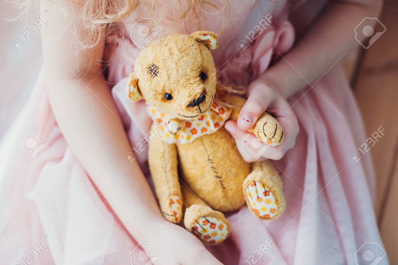 vintage teddy bear in little girl s hands best friends forever