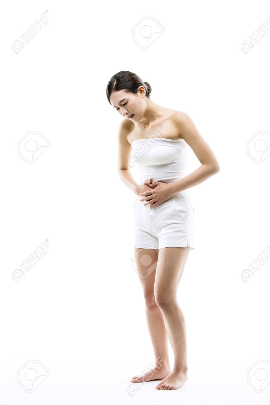 Asian Woman Suffering From Her Menstrual Cramps/stomach Pain - Isolated On  White Stock Photo, Picture and Royalty Free Image. Image 70605046., image size:866x1300