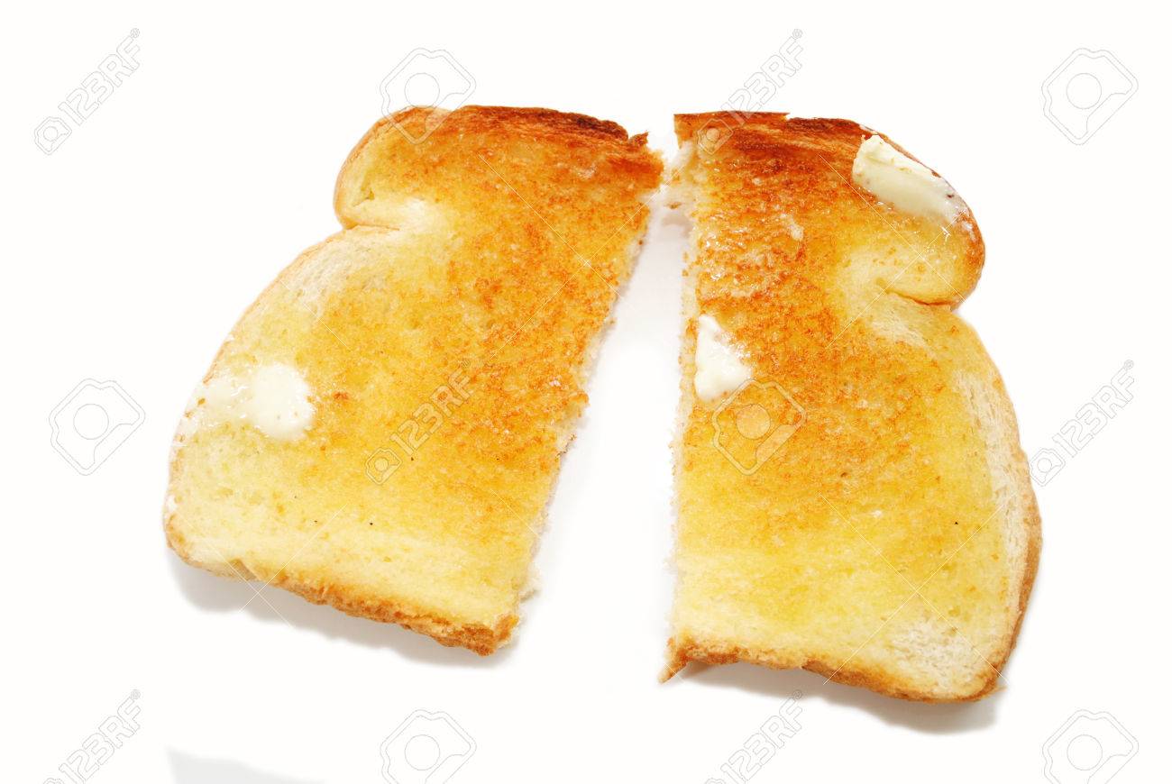 a slice of buttered toast cut in half stock photo picture and