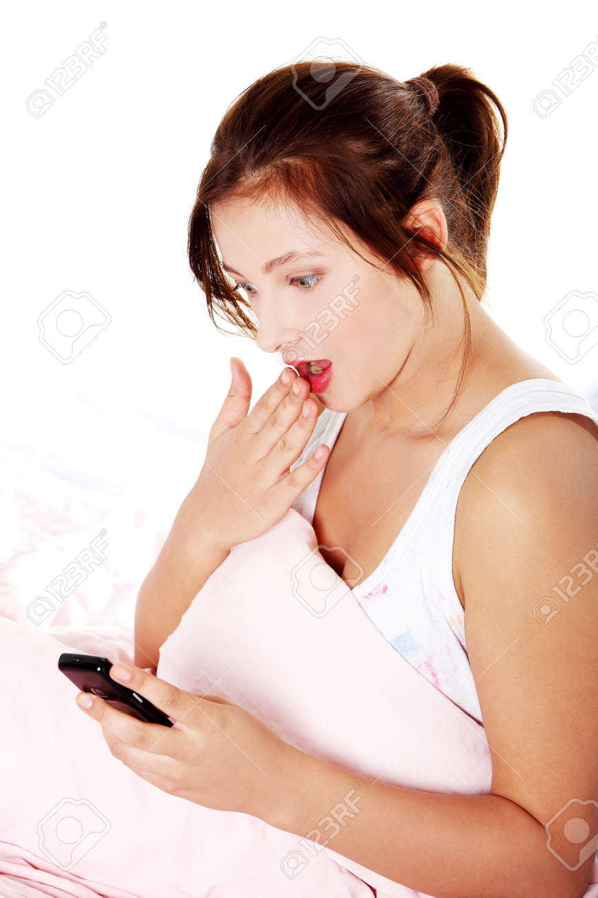 teen girls in bed shocked teen girl reading message on her mobile phone in bed over white background stock teen girl reading message on her mobile phone in bed teen girls in bed shocked teen girl reading message on her mobile phone in bed over white background stock teen girl reading message on her mobile phone in bed