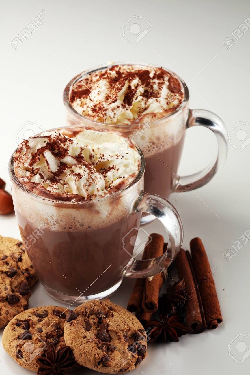 Hot chocolate cocoa with whipped cream on table - 111135640 Hot chocolate cocoa with whipped cream on table - 111135640