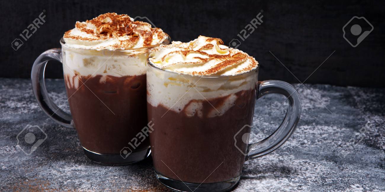 Hot chocolate cocoa with whipped cream for xmas on table. - 113718050 Hot chocolate cocoa with whipped cream for xmas on table. - 113718050