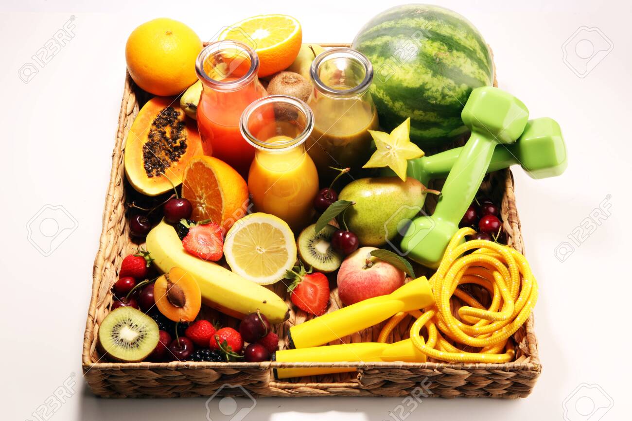 Healthy fruits lifestyle concept. healthy smoothies and sport fitness equipment, dumbbells and jumping rope. - 123590715 Healthy fruits lifestyle concept. healthy smoothies and sport fitness equipment, dumbbells and jumping rope. - 123590715