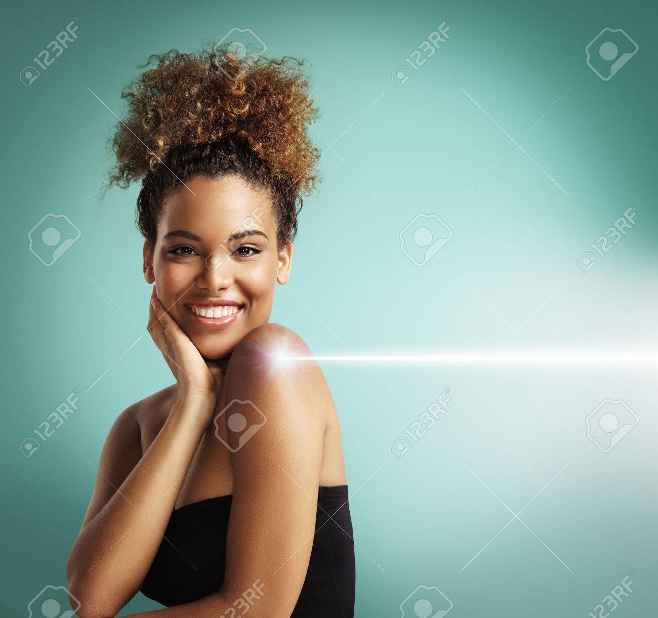 happy woman making a laser cosmetology procedure - 34674935 happy woman making a laser cosmetology procedure - 34674935