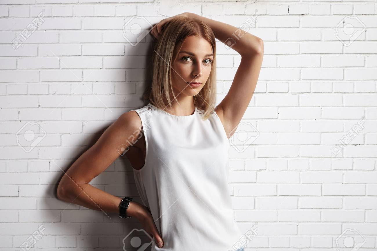 woman in a blank t-shirt. brick wall background - 34676673 woman in a blank t-shirt. brick wall background - 34676673