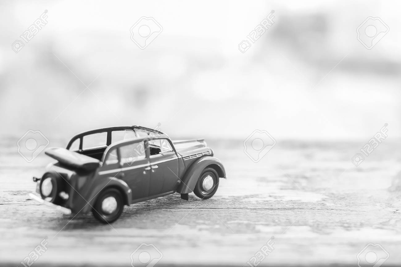 Toy Vintage Cabrio Car On Wooden Background Travel Motivation Black And White Stock Photo Picture And Royalty Free Image Image 82567022