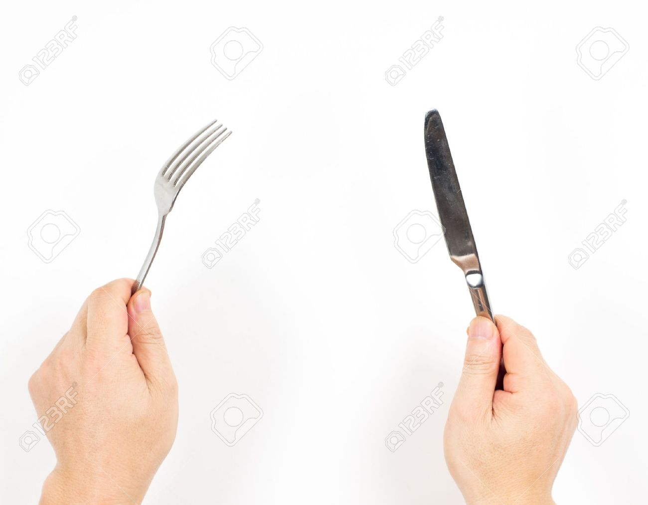 白い背景で隔離の手にナイフとフォーク の写真素材 画像素材 Image