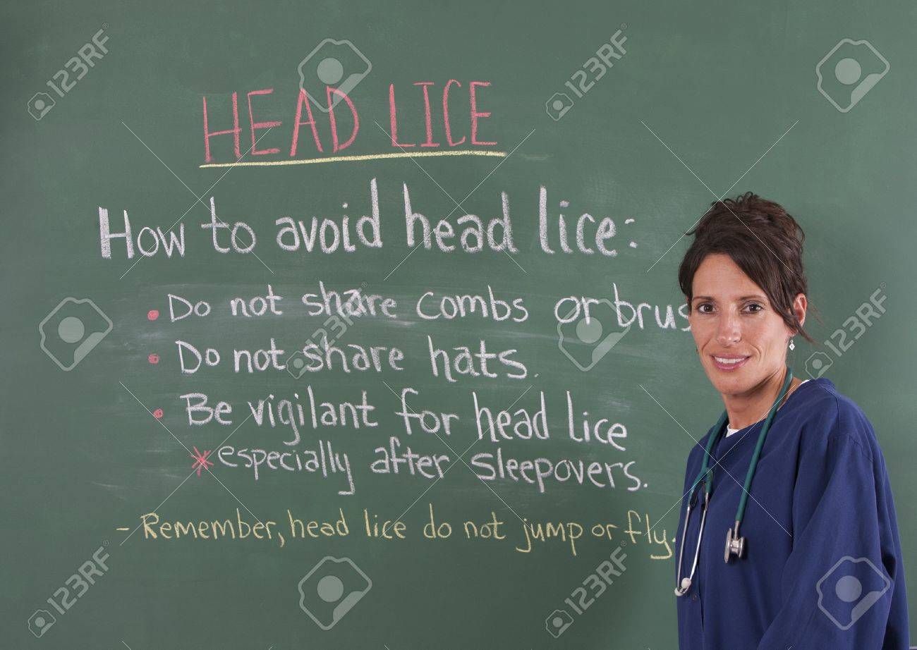 school nurse teaching about head lice on chalkboard of classroom