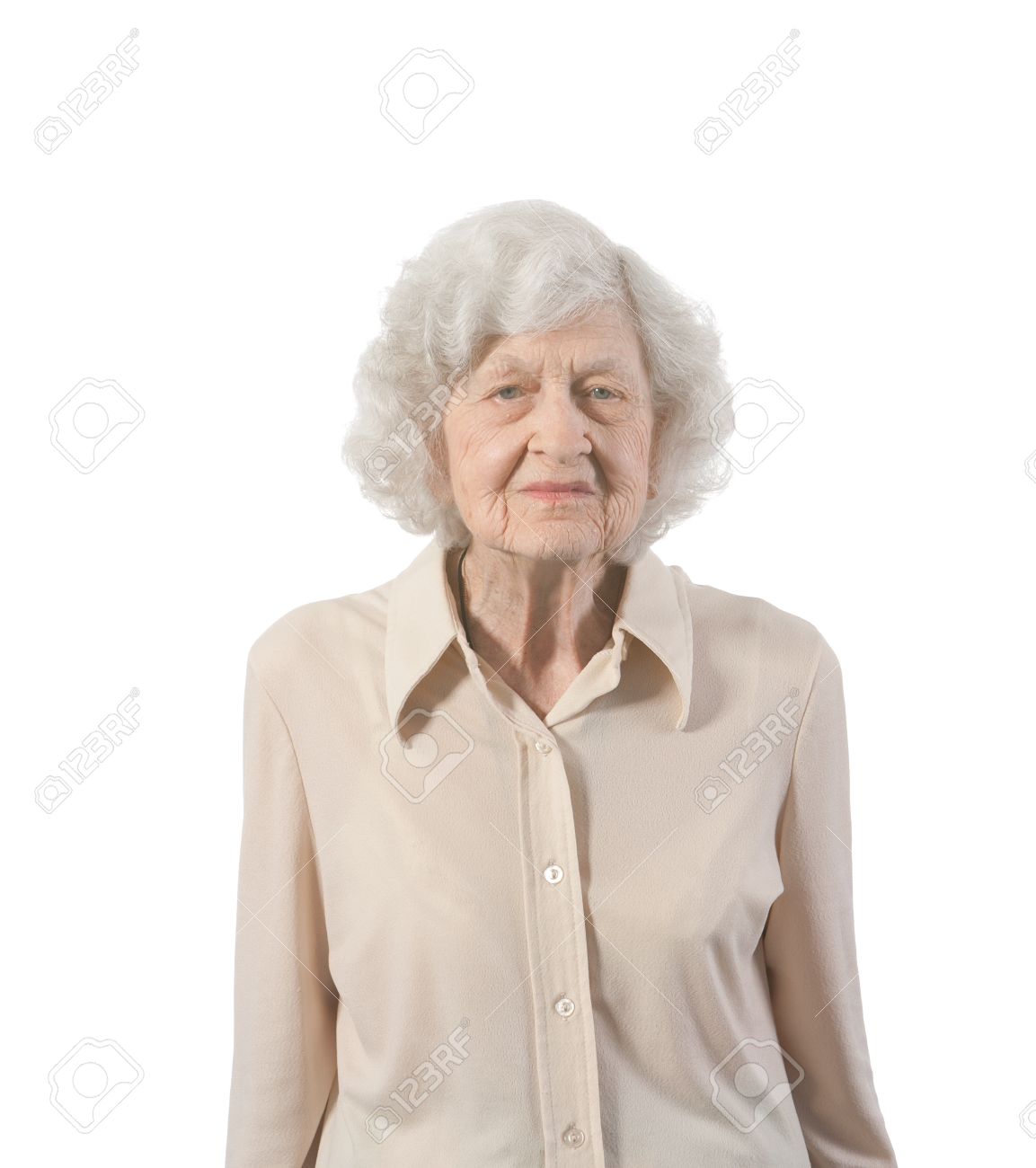 Portrait Of Elderly Lady Standing Shot Against White Background