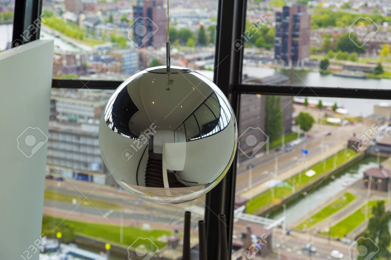 Decorative Mirror Ball Hanging From Ceiling In Office Tower