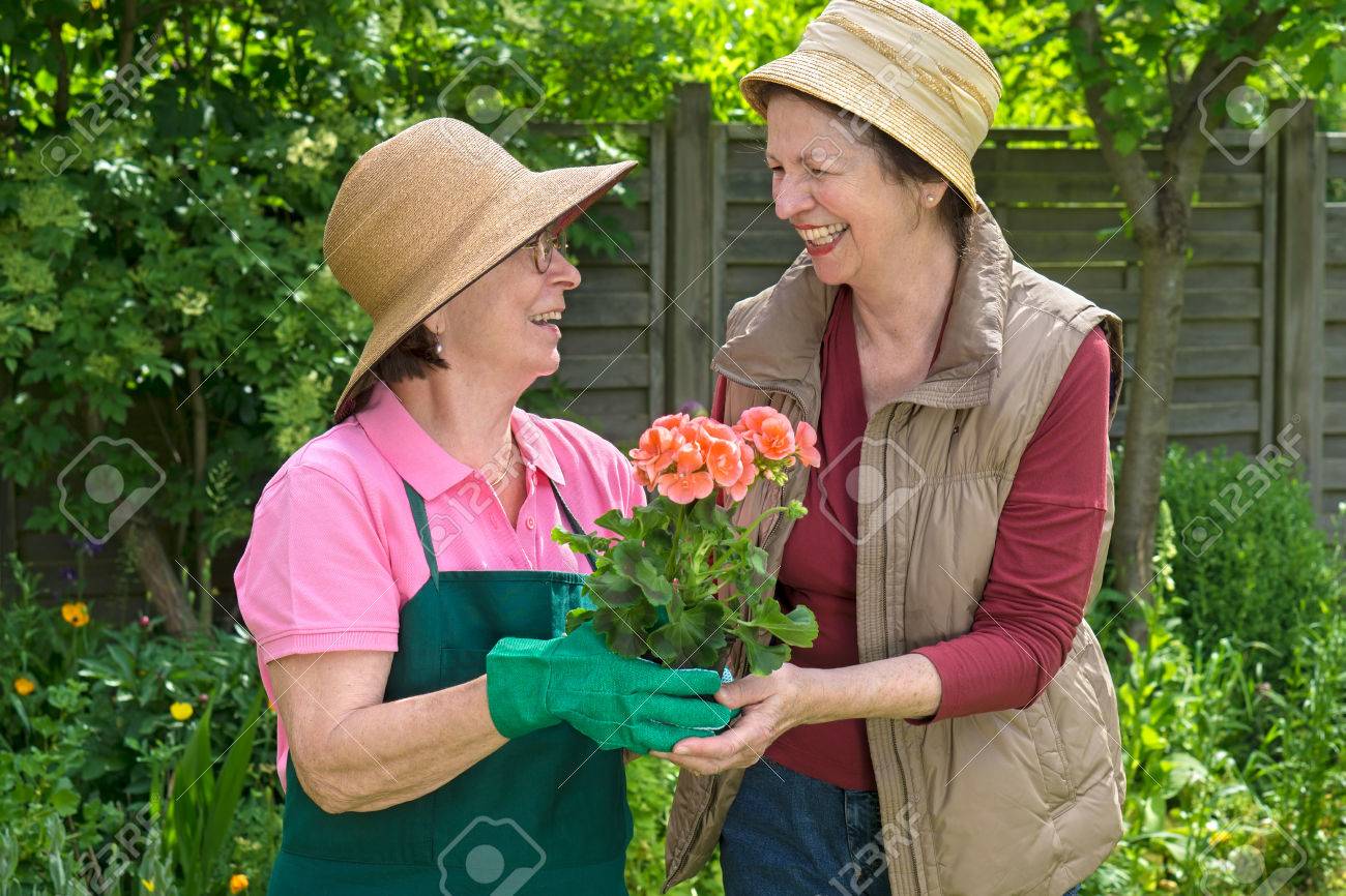 Two Happy Senior Ladies Gardening 