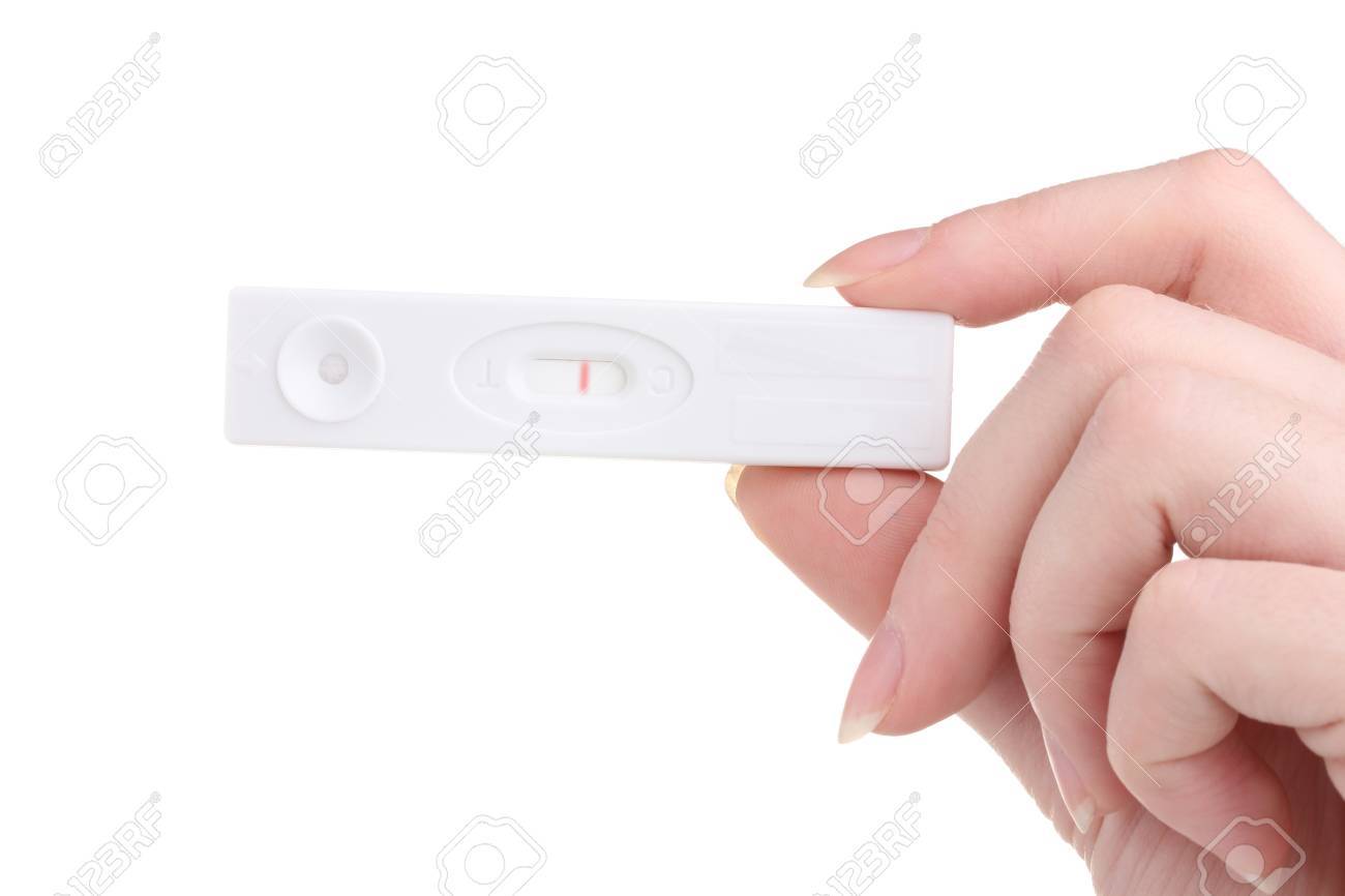 白で隔離される手で妊娠検査 の写真素材 画像素材 Image