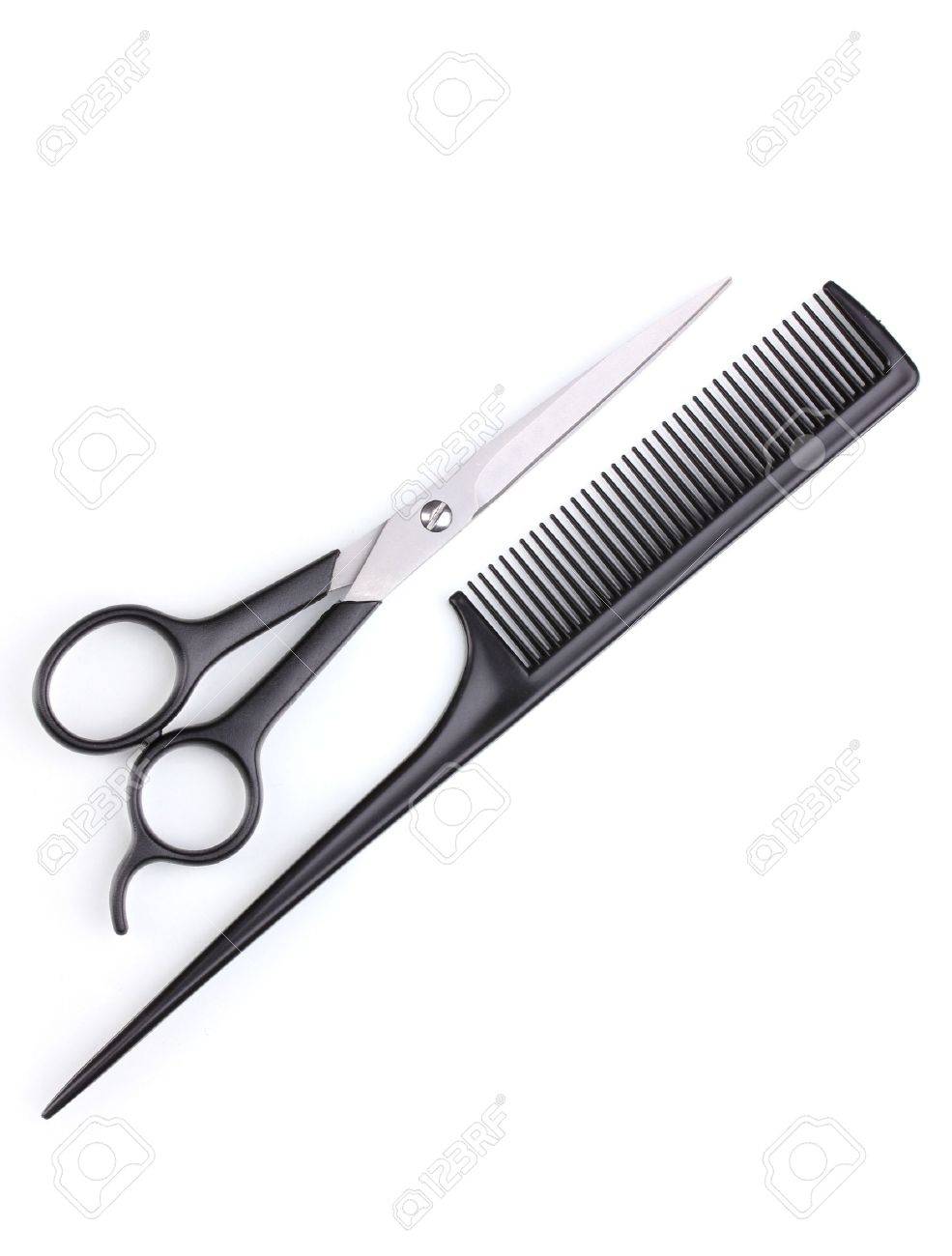 Hair cutting shears and comb isolated on white