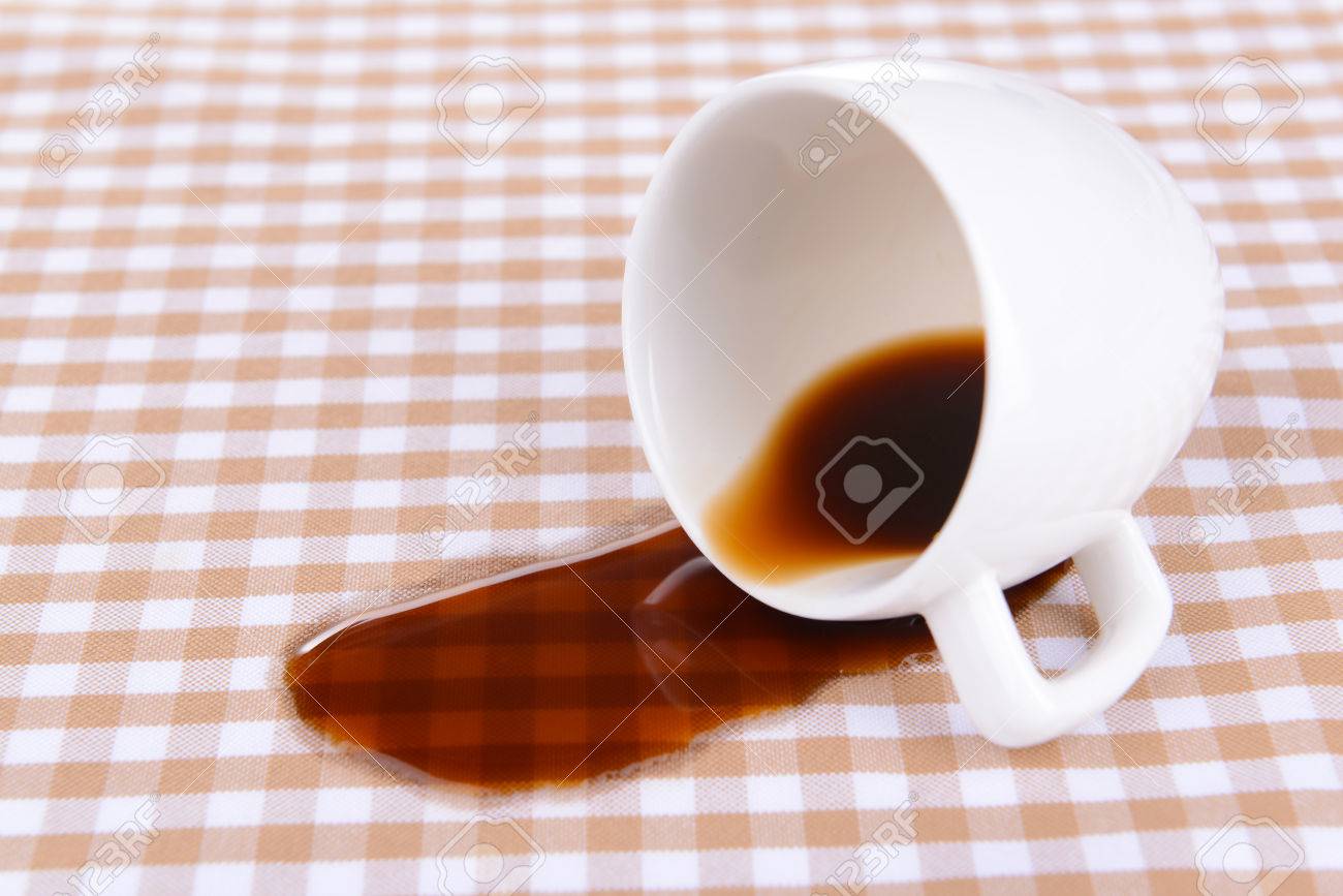 overturned cup of coffee on table close-up stock photo, picture overturned cup of coffee on table close-up stock photo, picture