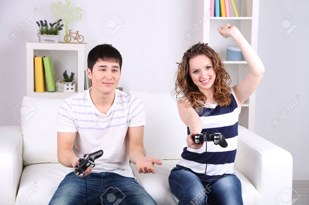 girl and boy playing video games