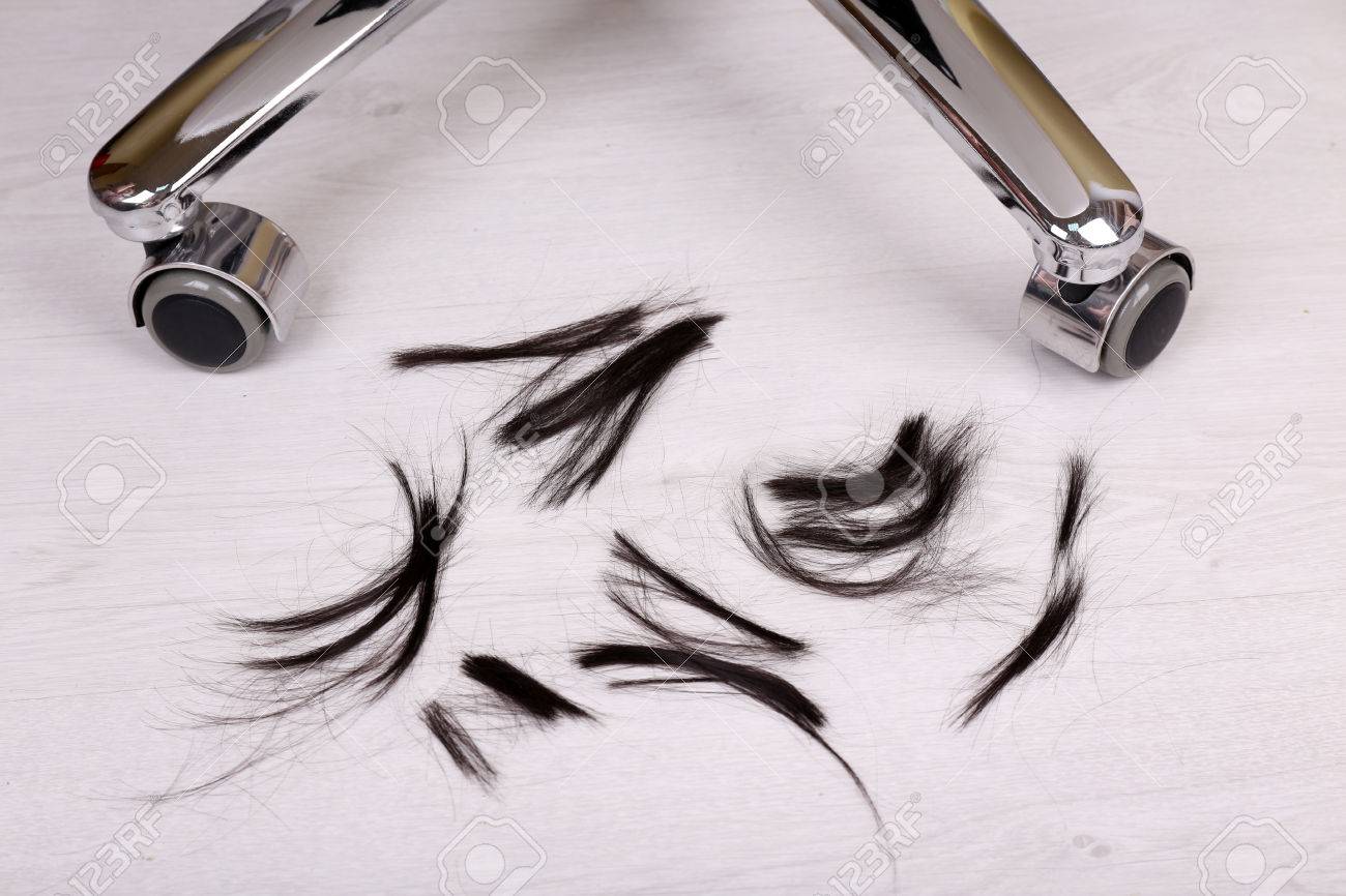Cut Hair On The Floor In Hairdressing Salon Close Up Stock Photo