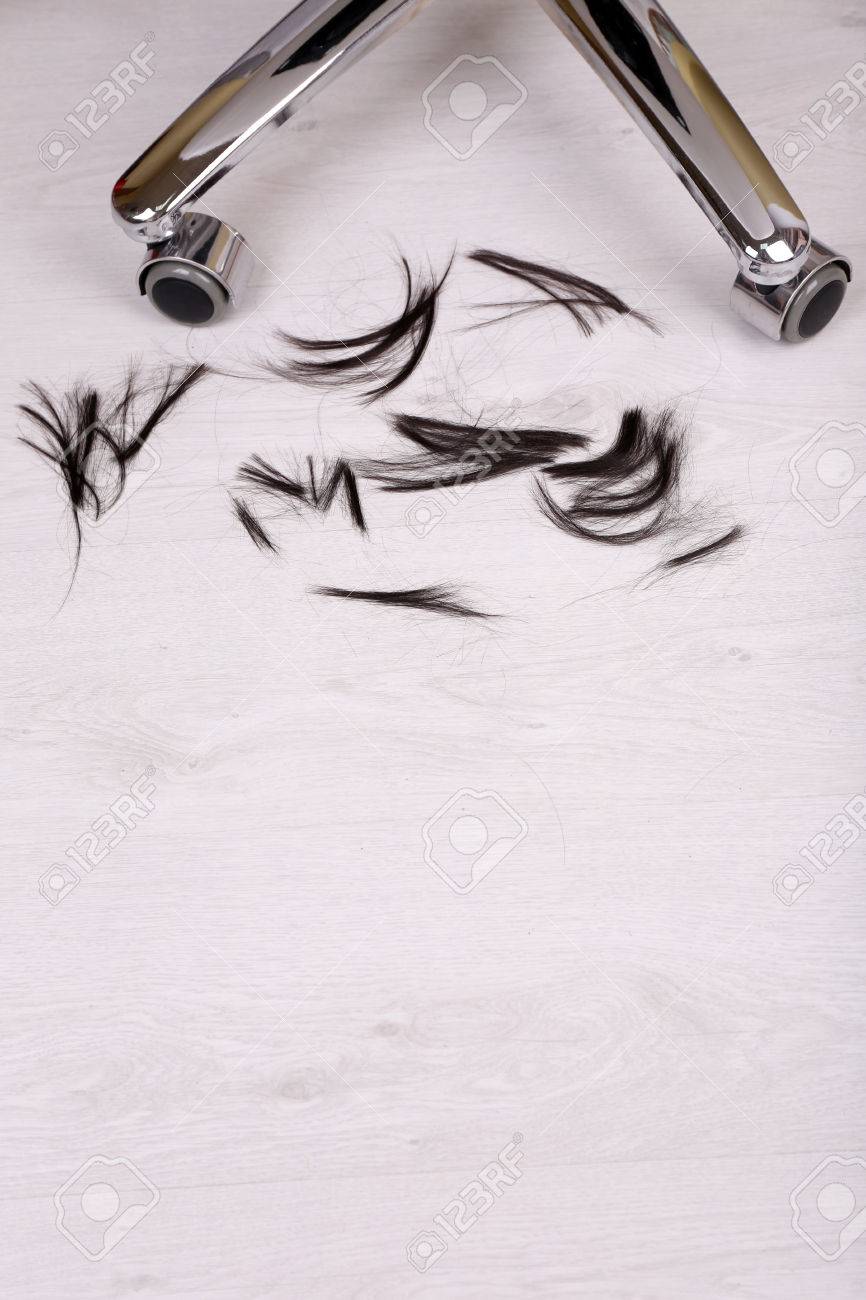 Cut Hair On The Floor In Hairdressing Salon Close Up Stock Photo